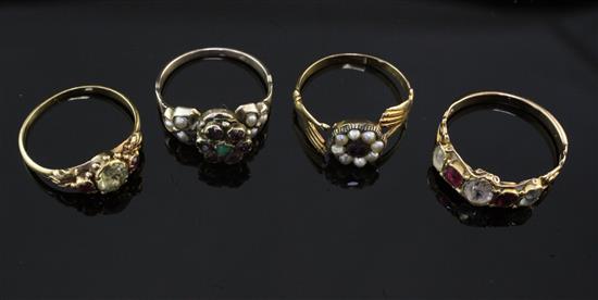 Four late 19th/early 20th century gold and gem set rings, various sizes.